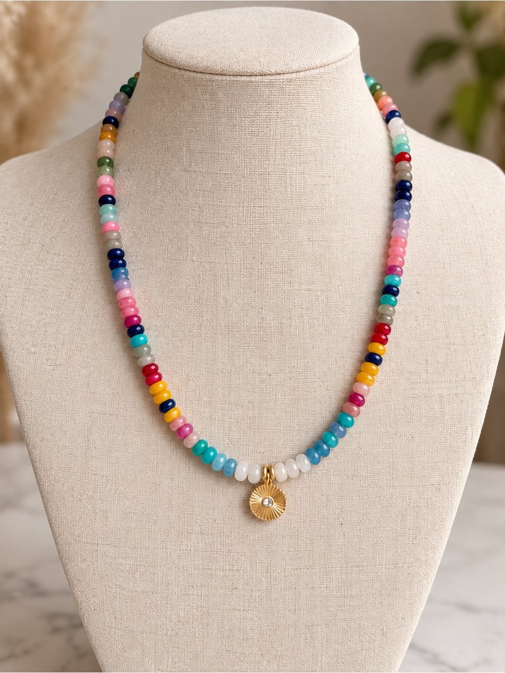 Colorful Beaded Necklace with Gold Sunburst Charm